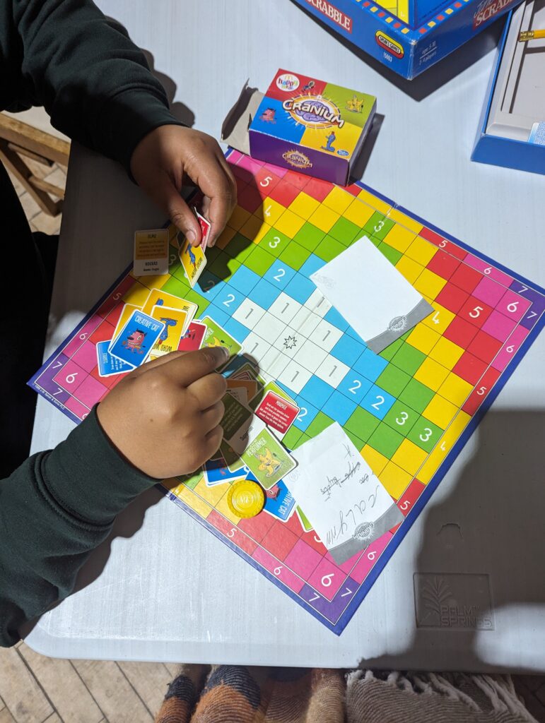 a child playing a boardgame.